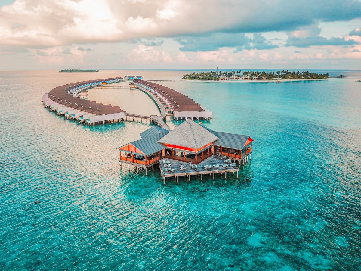 Crystal-clear turquoise waters and luxurious overwater villas in the Maldives.